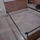 Black metal and rattan bed frame