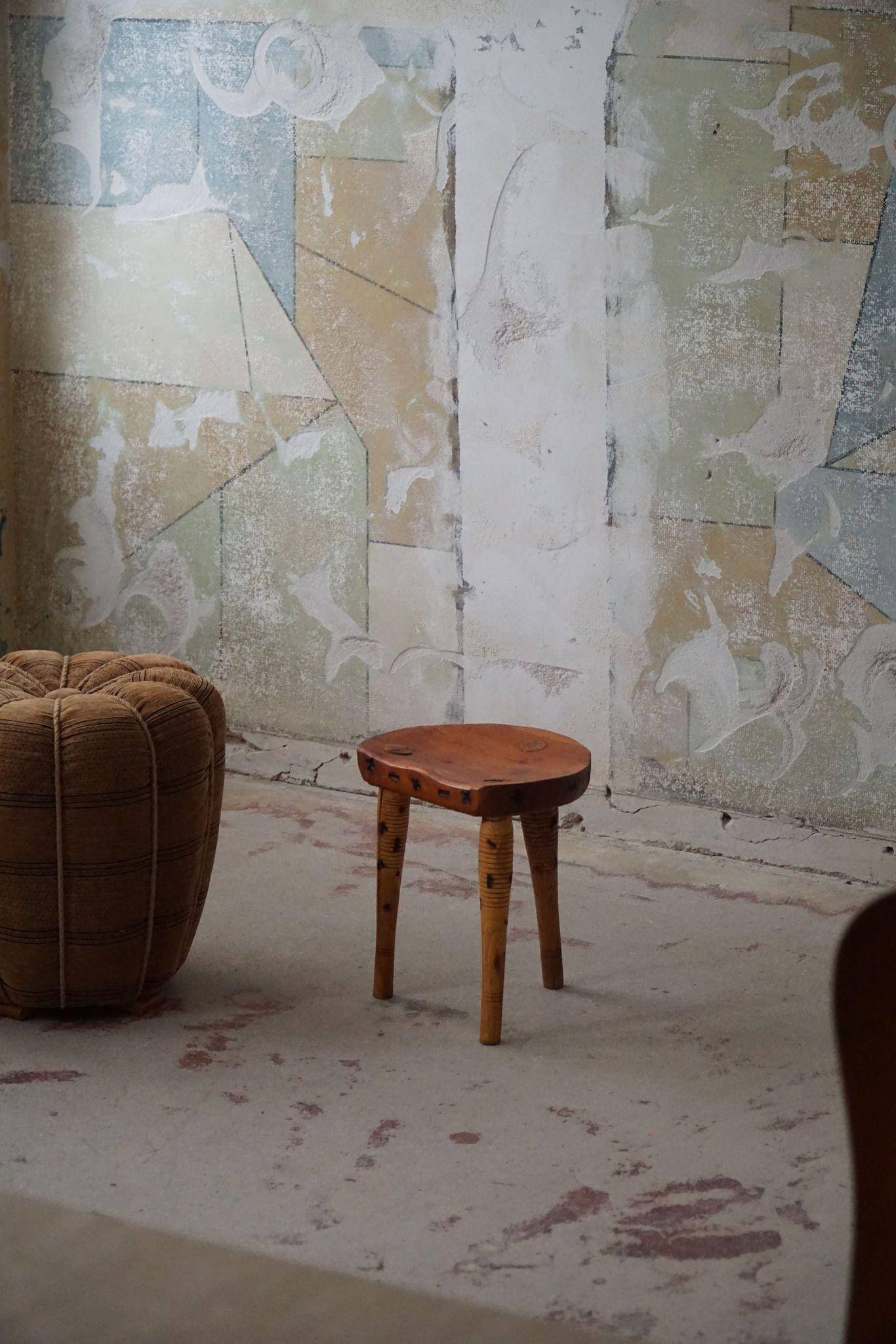 Primitive tripod stool in solid pine, modern Swedish style, from the 1950s.