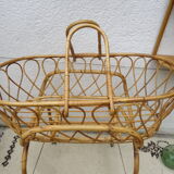 Rattan bassinet on folding support
