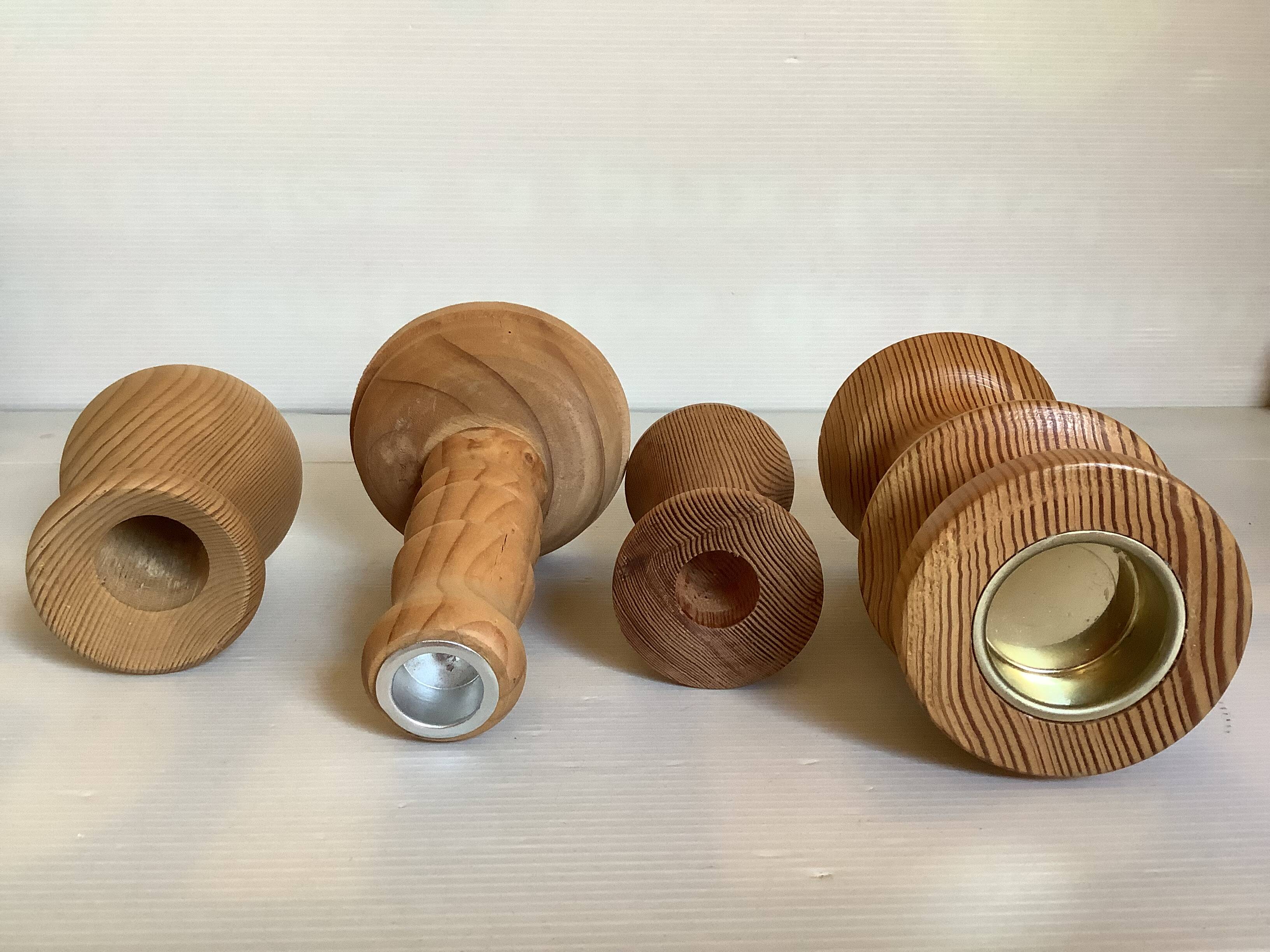 Four wooden vases and candlesticks
