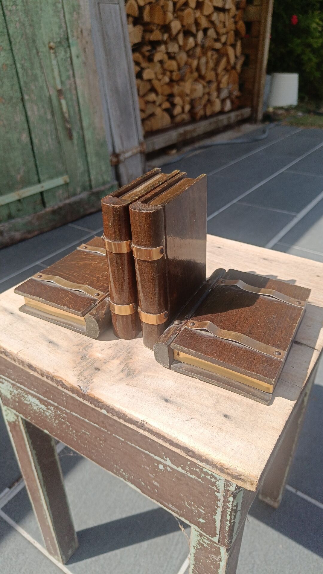 Wooden trompe-l'œil bookends with a book and box