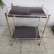 Rolling serving table in brass