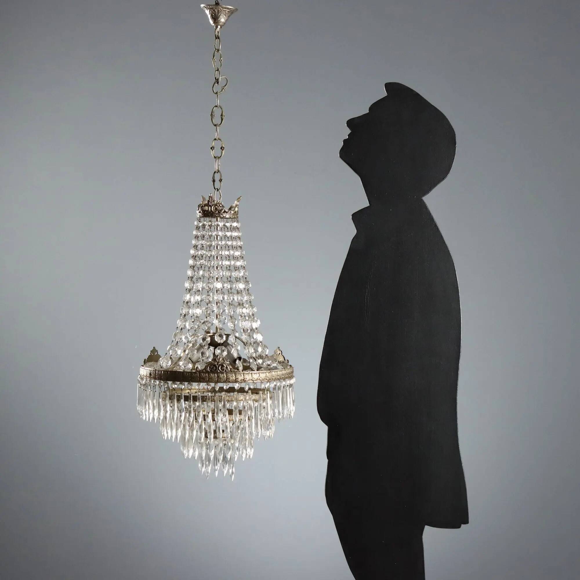 Antique chandelier in the shape of a balloon in silver-plated metal and glass, 20th century.