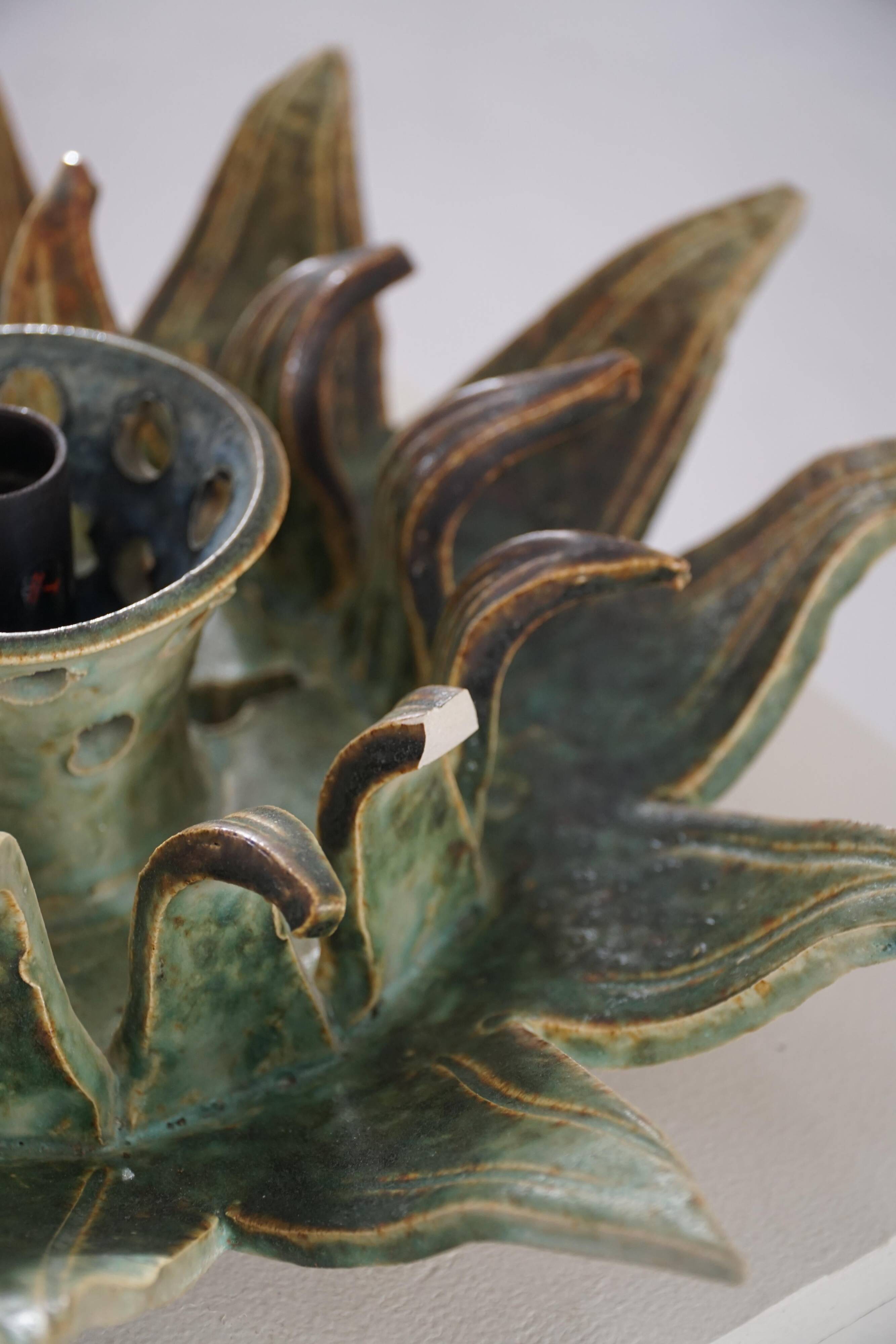 Mid-20th century ceramic sun wall lamp or decorative wall sculpture, 1960s.