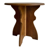 Solid oak side table with a wavy leg.