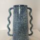 Blue-green ceramic vase with abstract wavy handles
