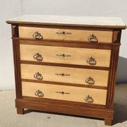 Old chest of drawers with white marble.