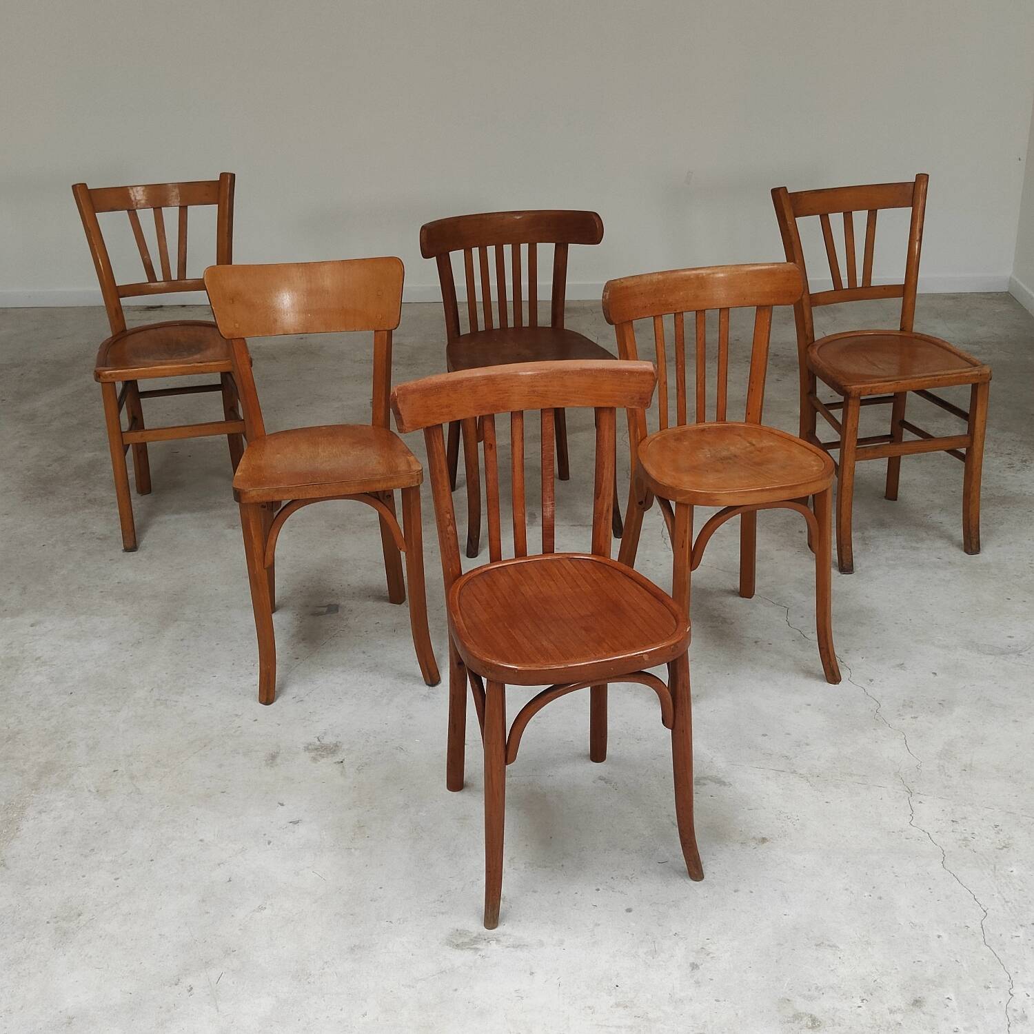 Set of 6 mismatched blond wood bistro chairs