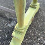 Old table with patinated green legs