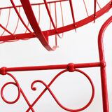 Baby cradle in red wrought iron