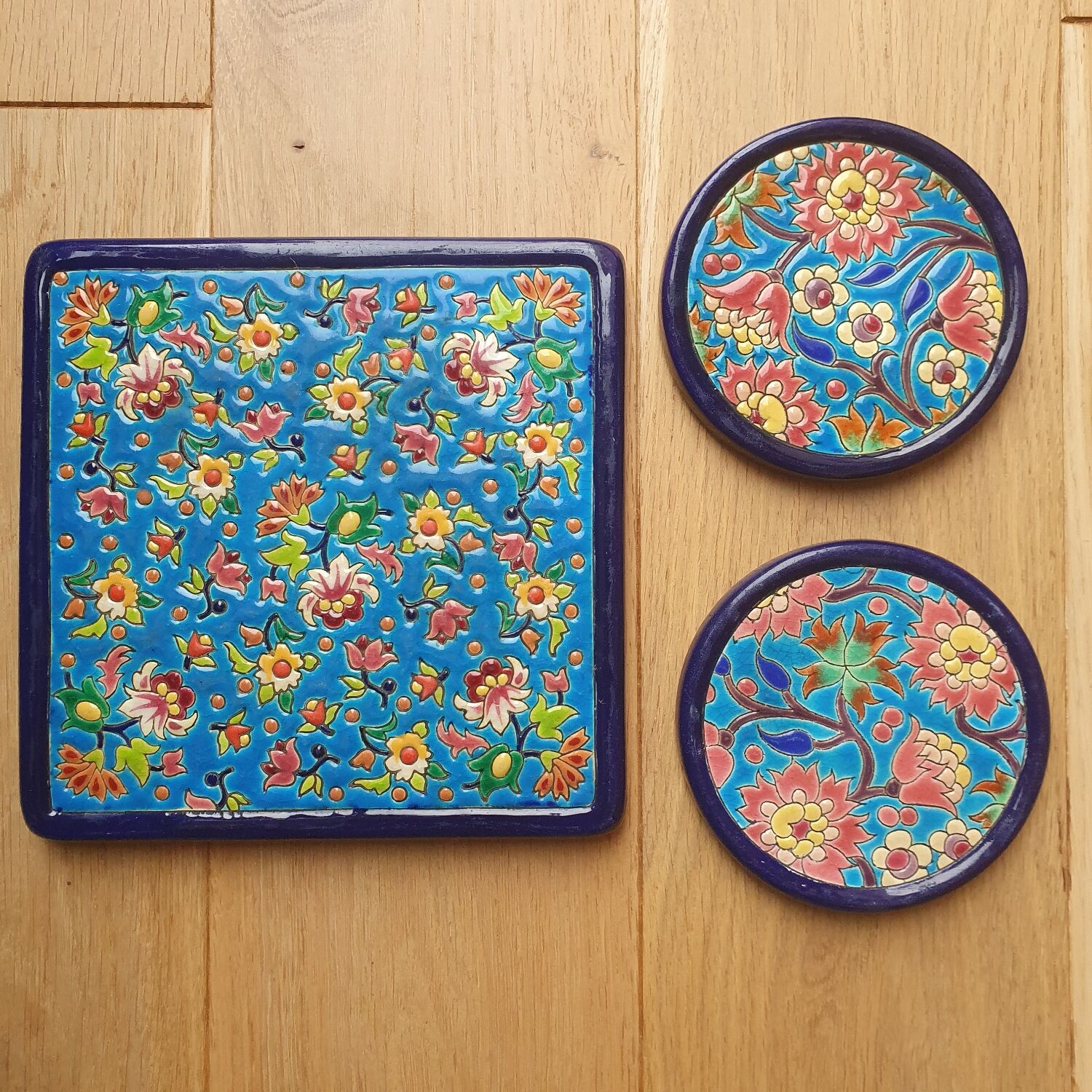 Trivet and Longwy enamel bottle