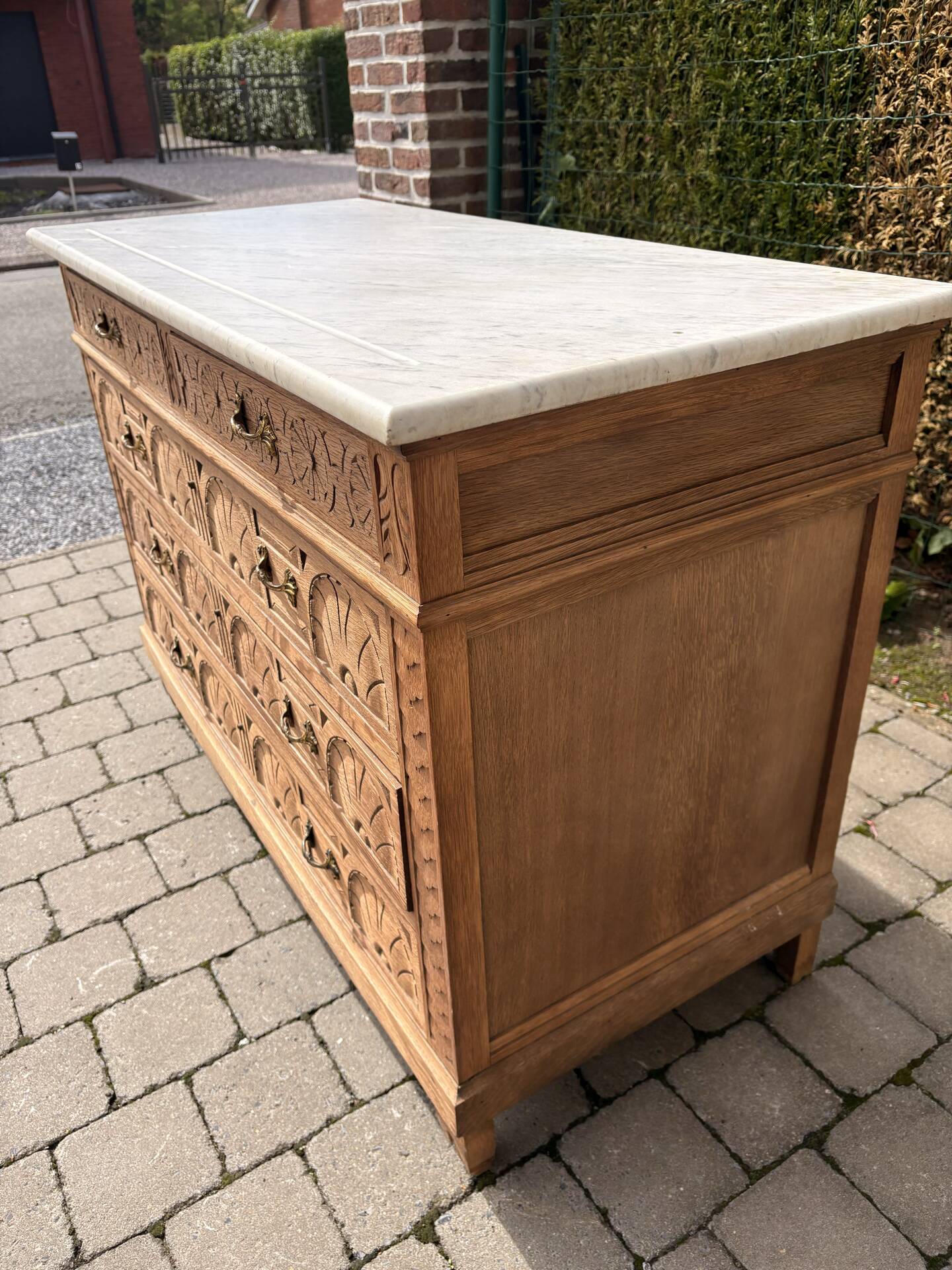 Solid oak chest of drawers with a marble top and original mirror.
