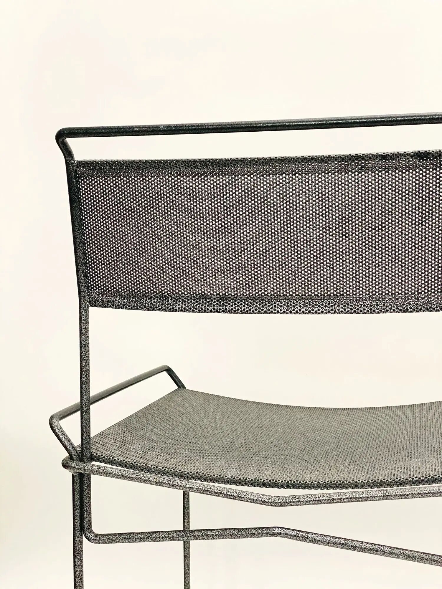 Perforated steel chairs