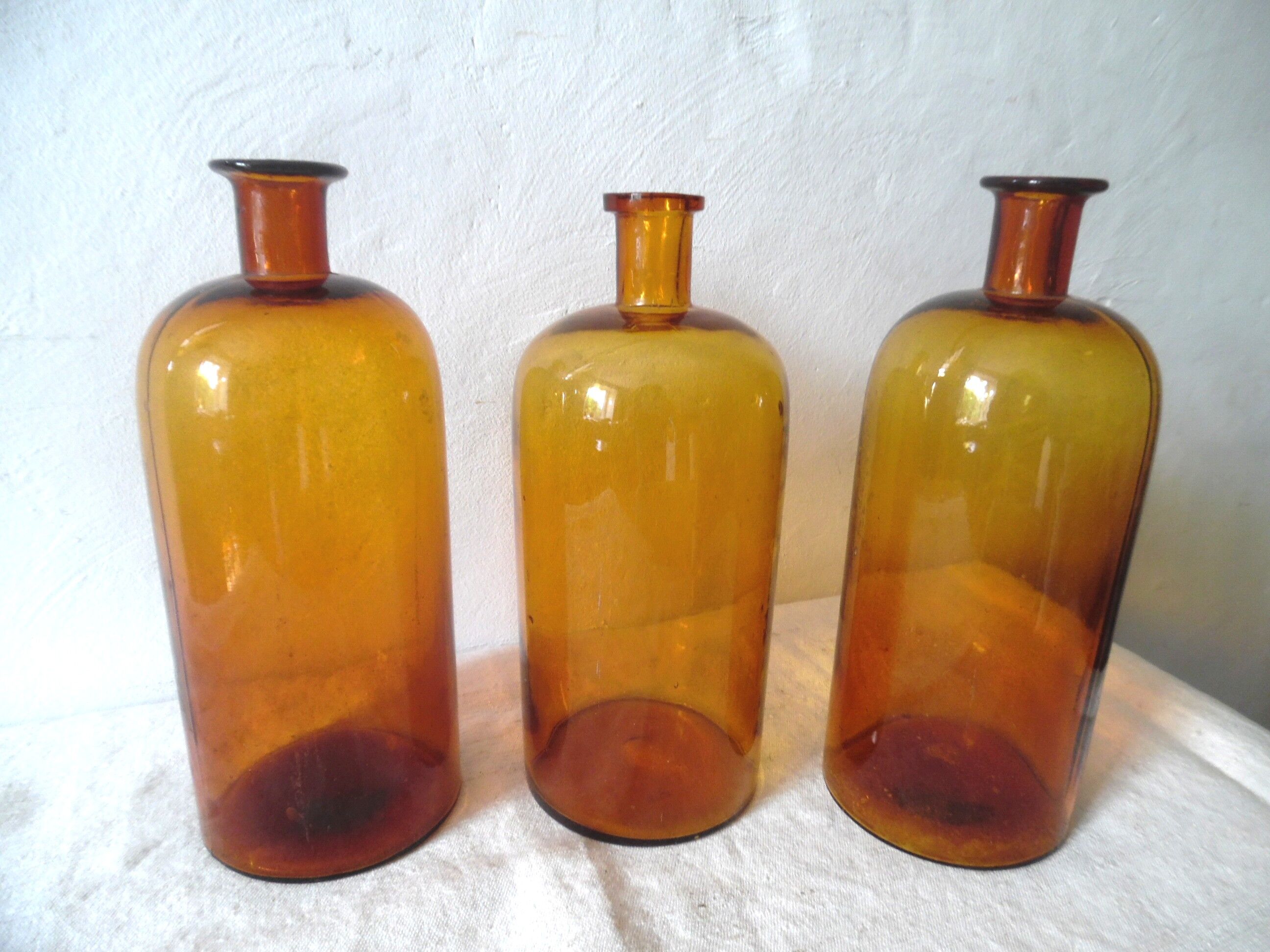 Trio pharmacy bottles