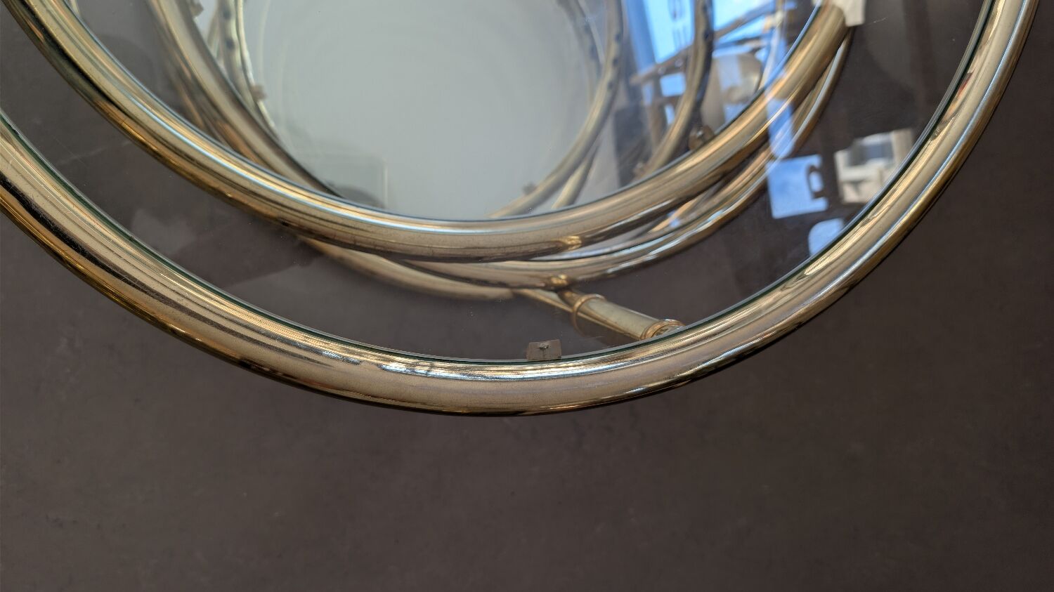 Gold brass coffee table with rotating trays.