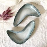 Pair of boomerang dishes signed in enamelled terracotta