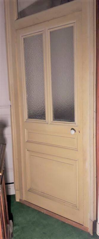 Large glazed door and its old glazed transom.