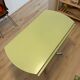 Round extendable folding Formica table with metal legs from the 50s/60s in green.