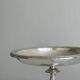 Silver-plated metal stand.