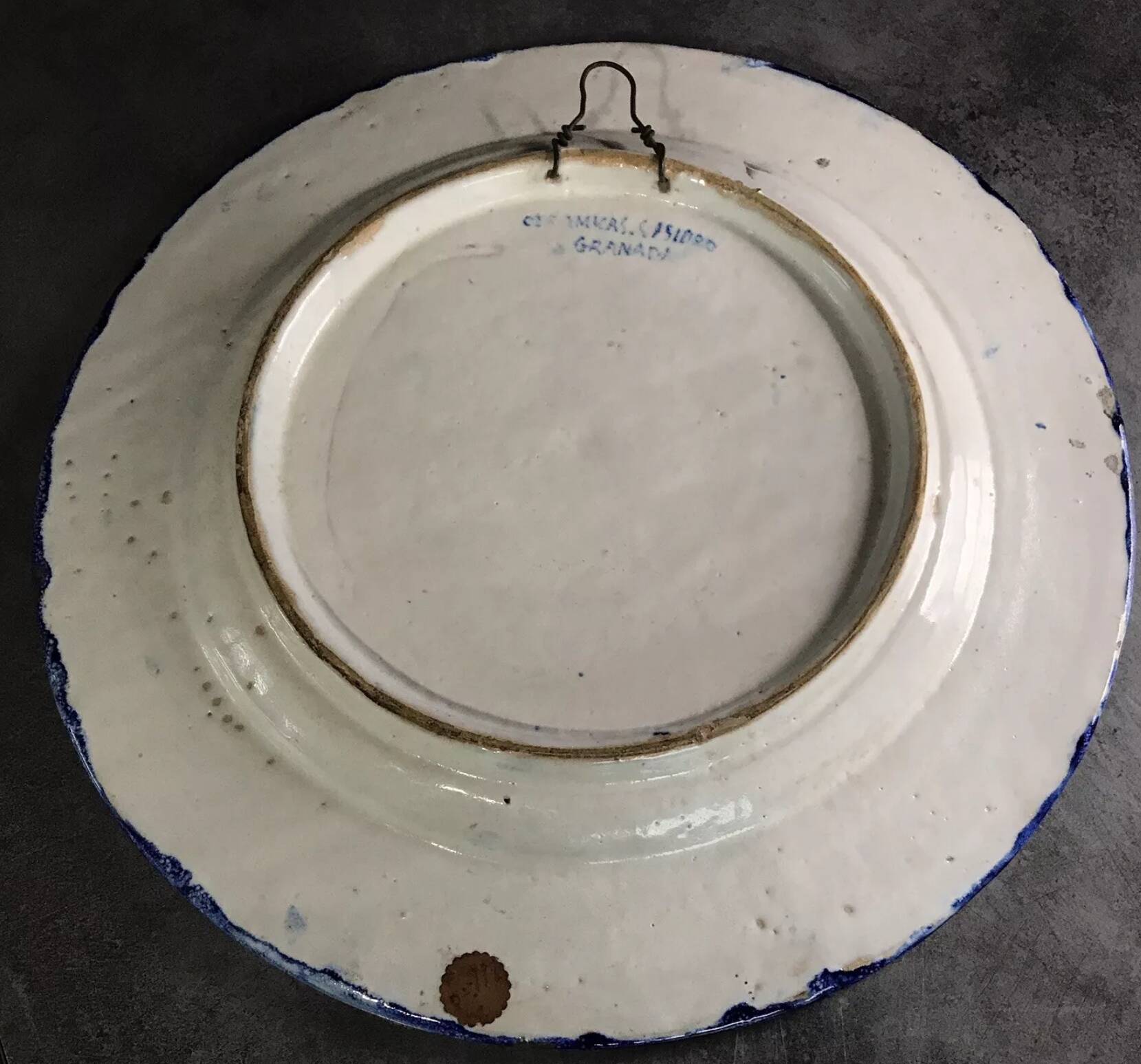 Antique glazed ceramic wall plate with battle scene decoration 41.5 cm