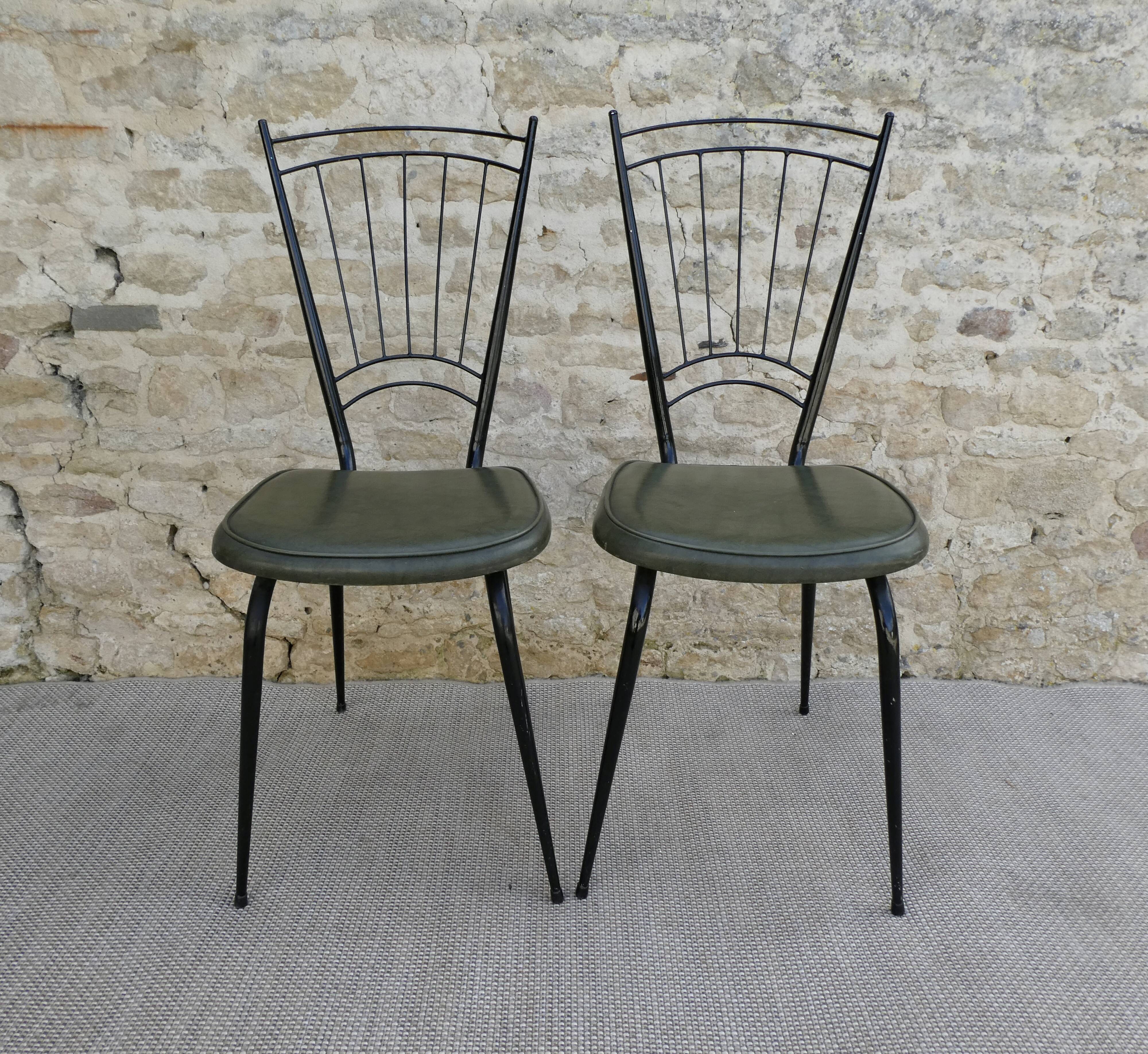 Pair of black metal chairs and khaki green skai, 60s
