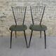 Pair of black metal chairs and khaki green skai, 60s