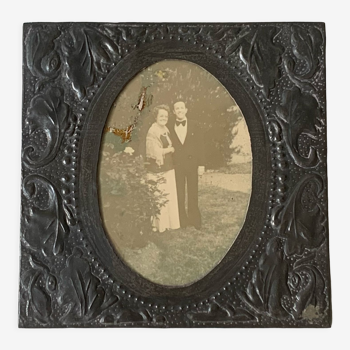 Old photo holder frame in vintage chiseled pewter