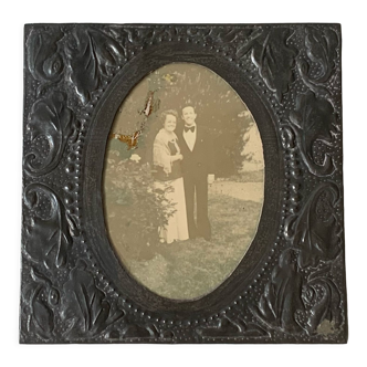 Old photo holder frame in vintage chiseled pewter