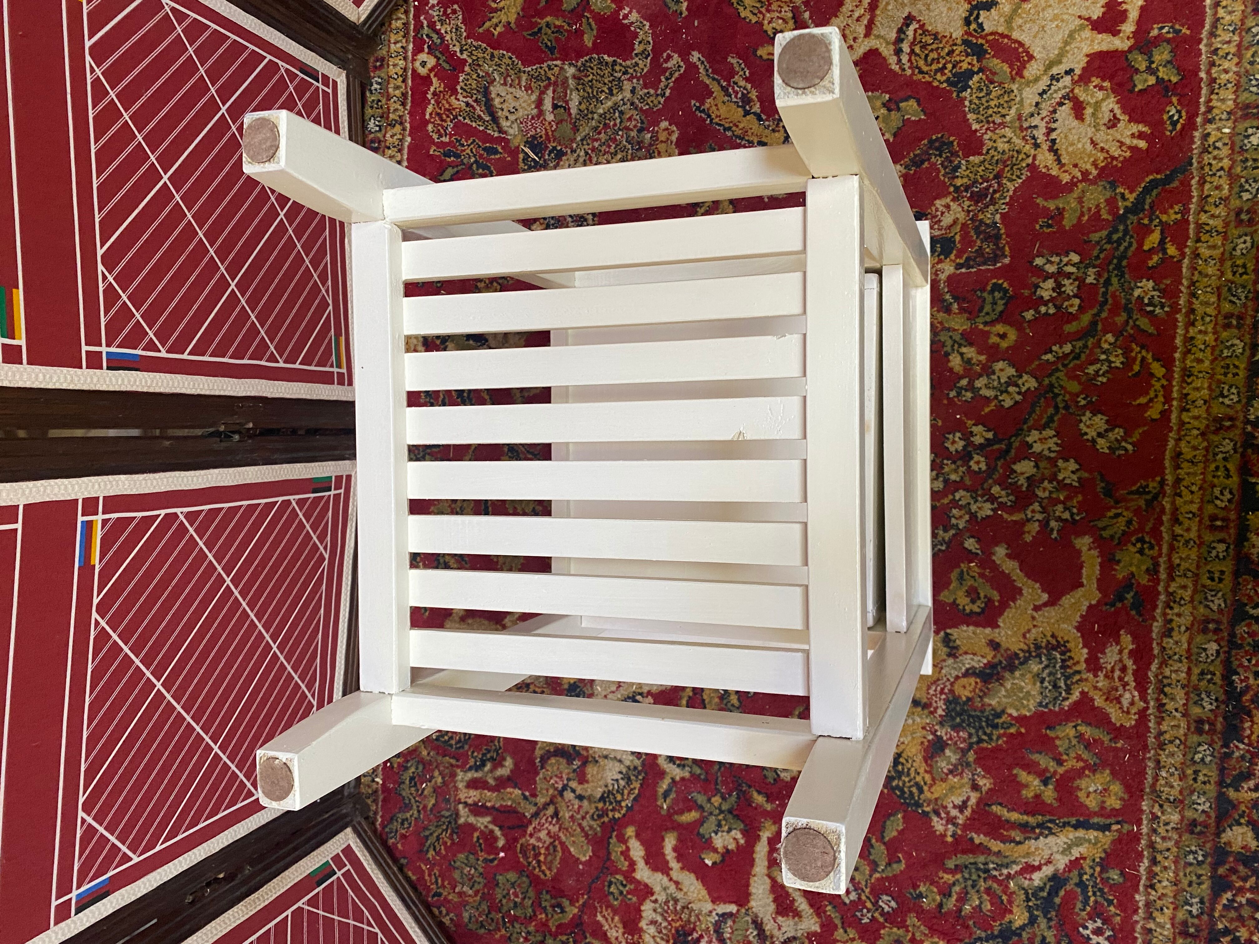 Wooden bedside table painted white