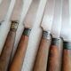 Old table knives and dessert knives, wooden handles, stainless steel blades