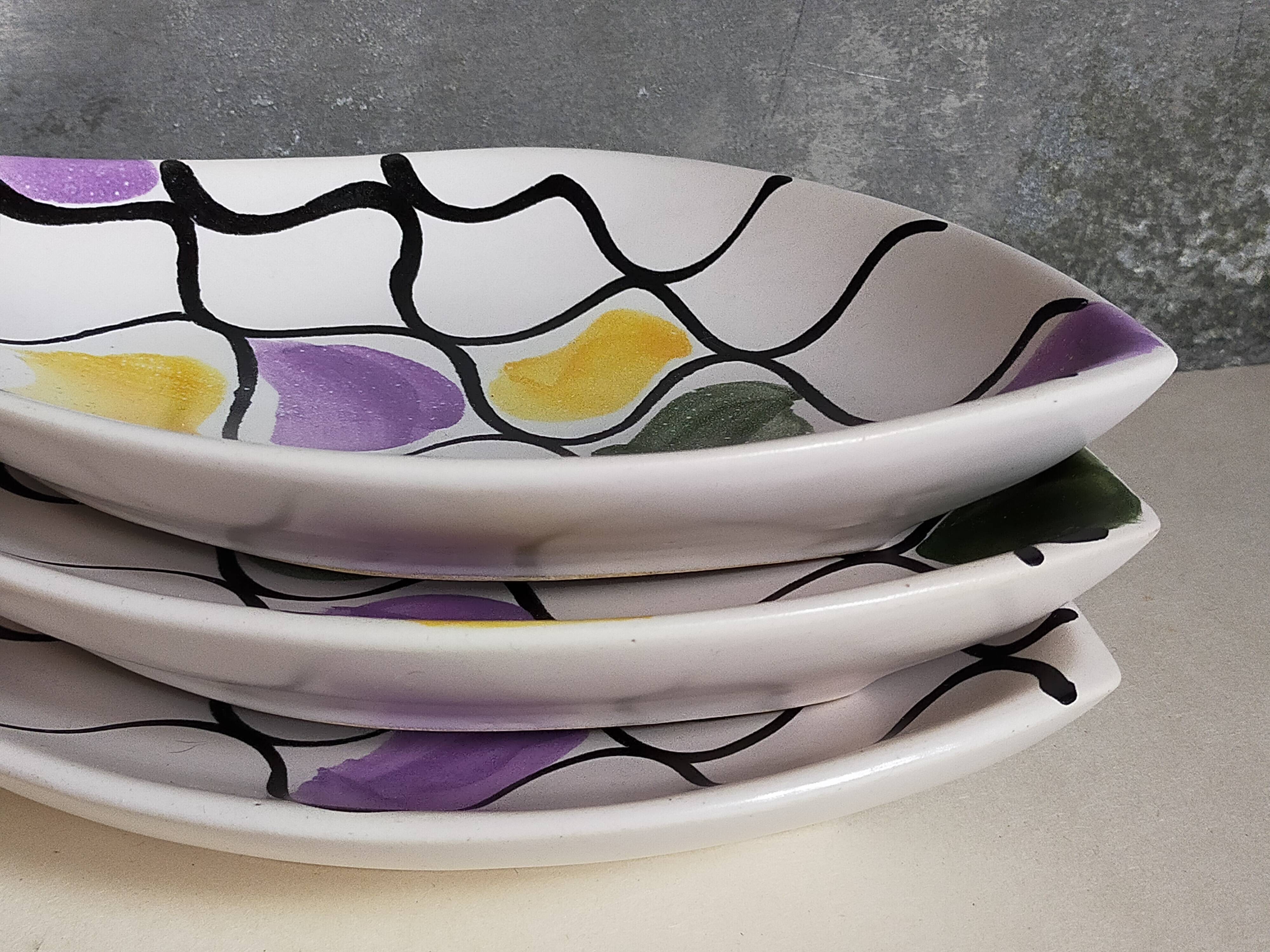 Three vintage free-form ceramic ravine dishes from the 1950s