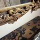 Gold wooden wall mirror with floral decoration