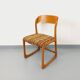 Vintage sled chair by Baumann in wood and wool fabric.