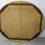 Golden oval mirror