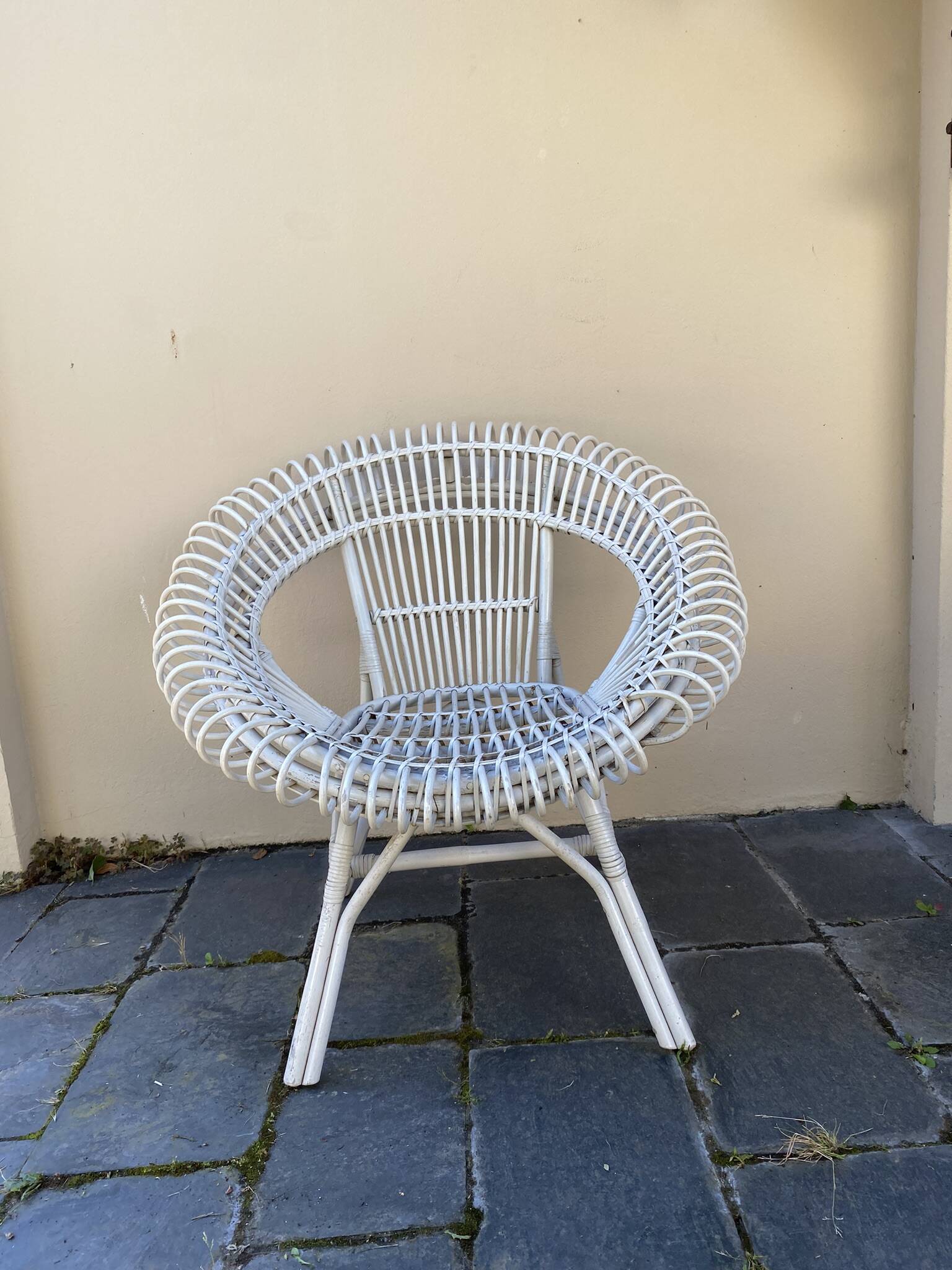 Vintage white rattan armchair