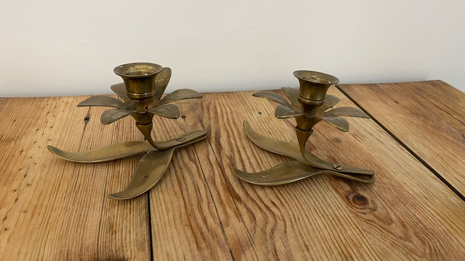 Pair of brass flower candlesticks