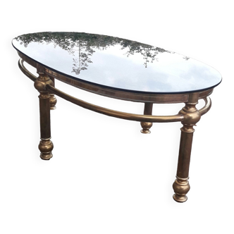 Oval coffee table in gilded brass and smoked glass 1970