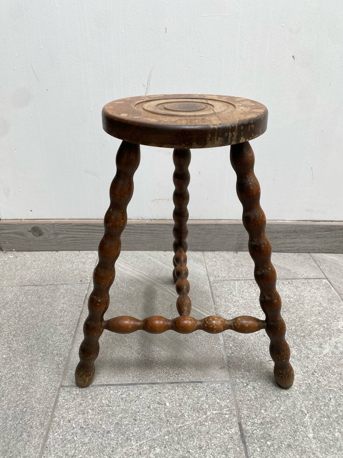 Wooden tripod farm stool