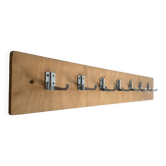 Vintage wall coat rack in teak and stainless steel.