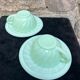 Two green opaline cup and saucer sets.