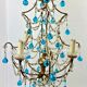 Italian chandelier with blue beads and gilded wood.