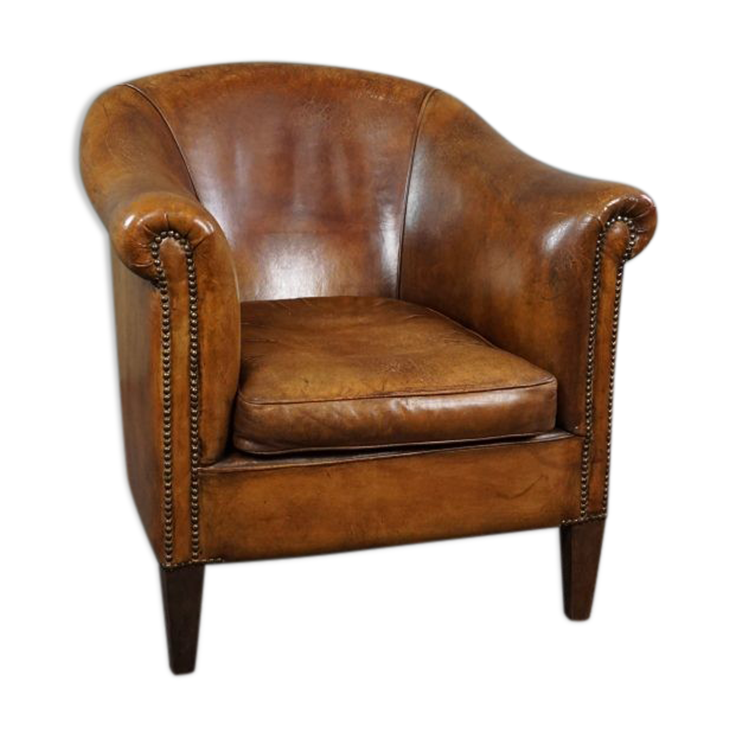 Club chair in patinated sheepskin