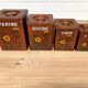 Série de 4 pots à épices en bois