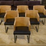 Set of 6 designer armchairs in oak and leather from the 1980s.