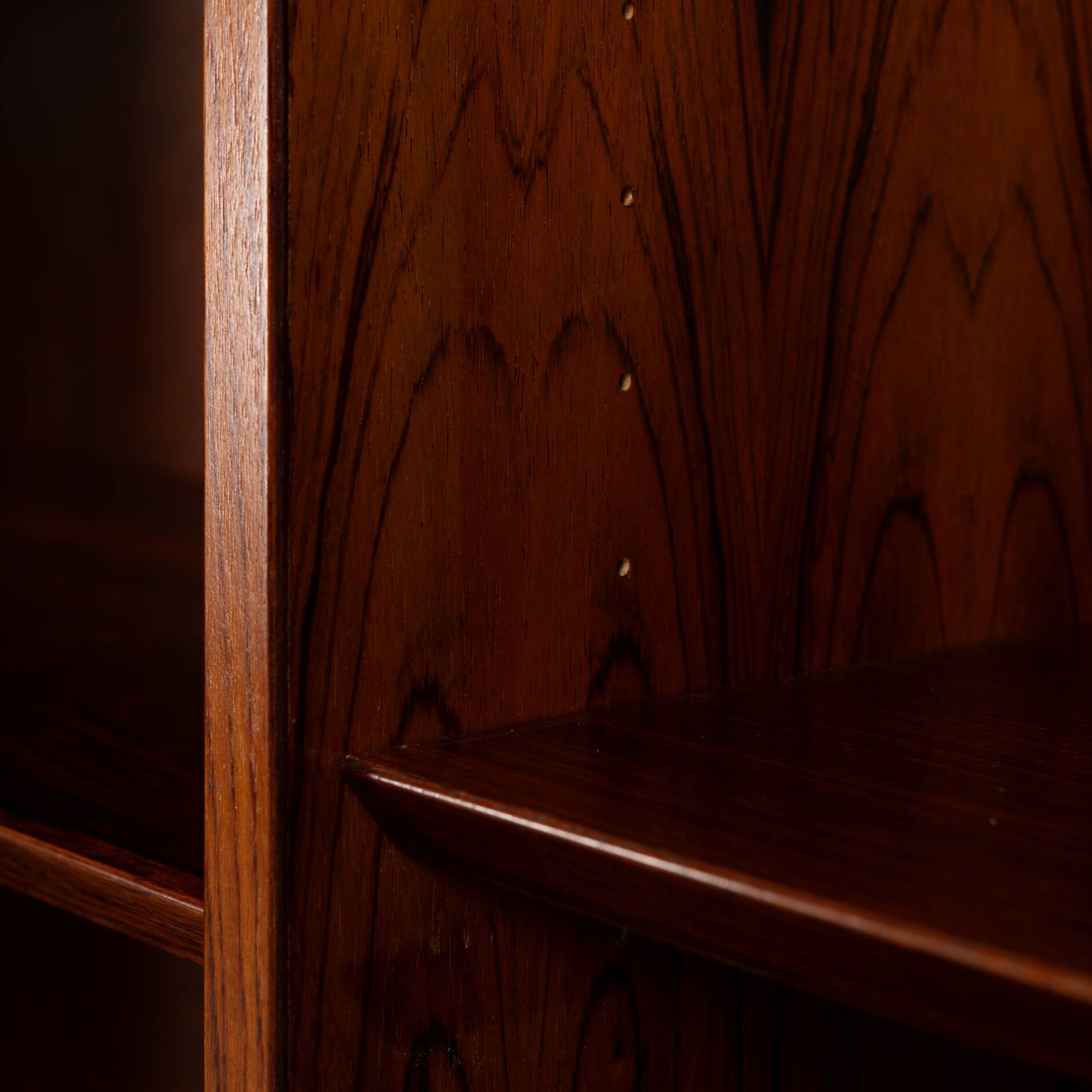 Rosewood library designed by Danish designers with doors by Hundevad & Co, 1960s.