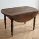 Antique solid wood drop-leaf dining table