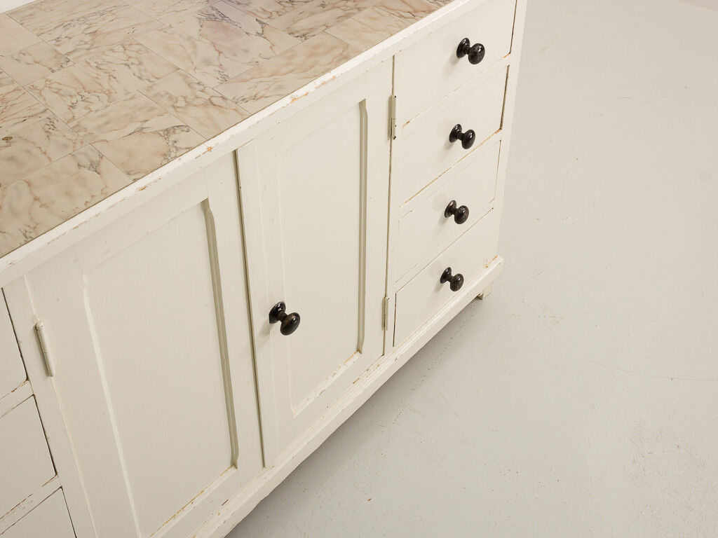 Small accent cabinet with drawers and swing doors