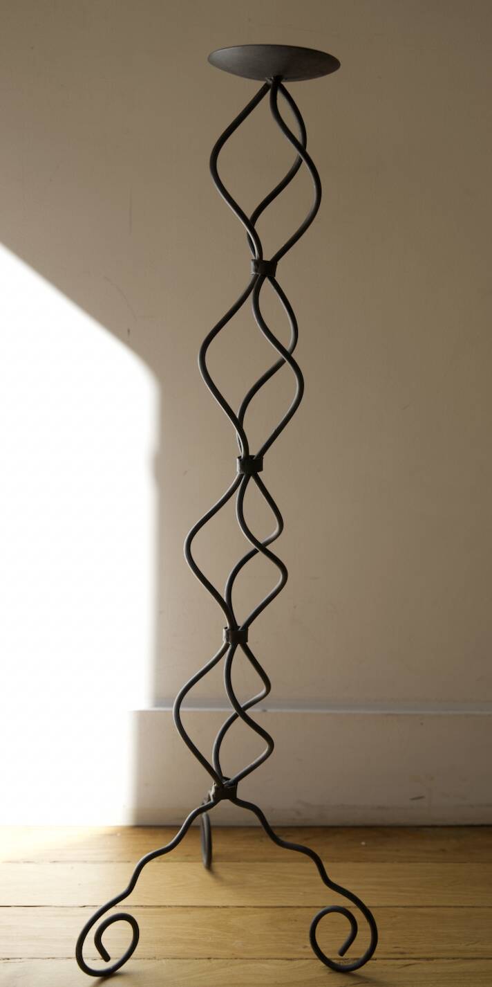 candlestick on wrought iron feet
