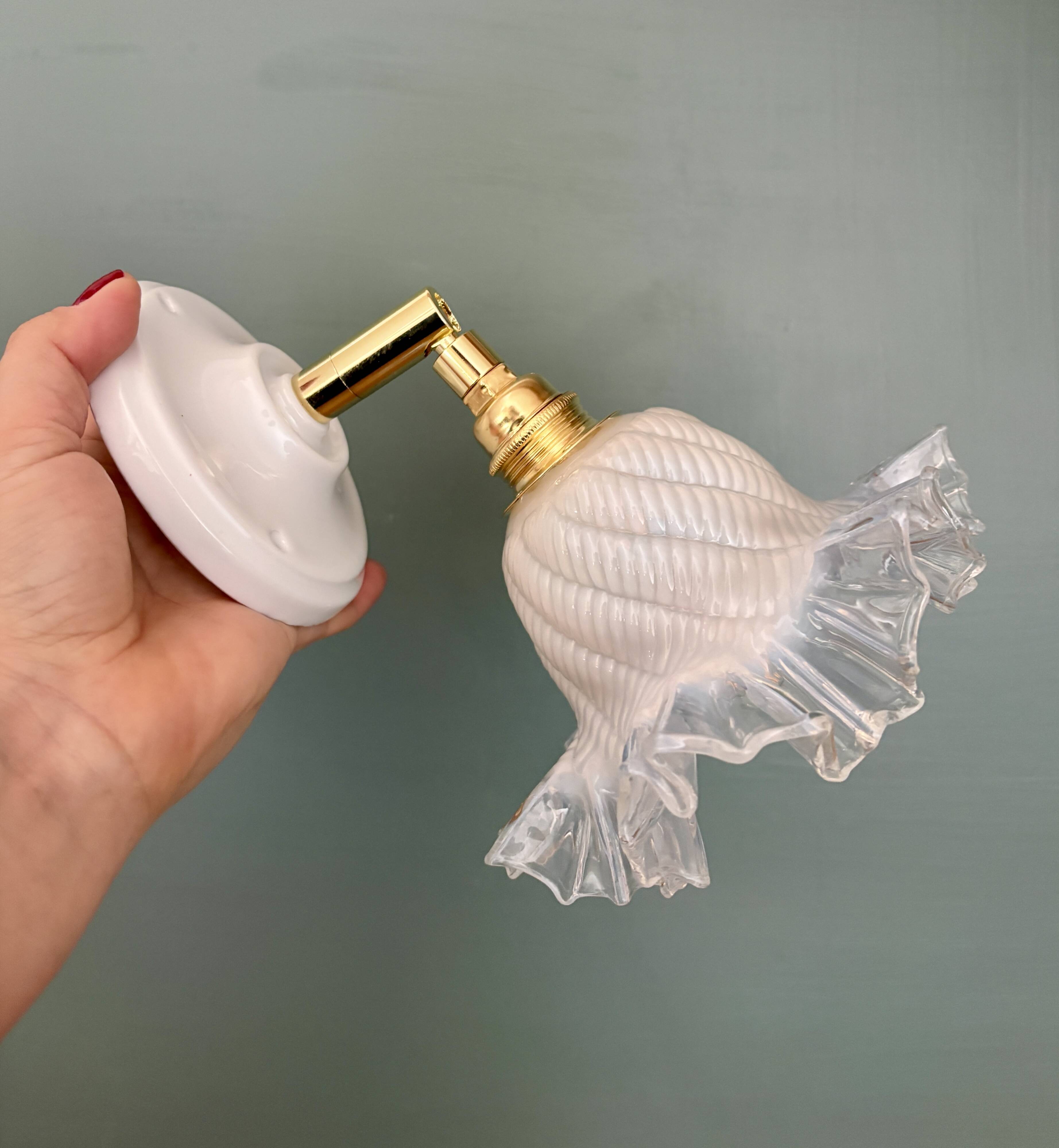 Vintage tulip glass wall light in transparent, slightly pearlescent white.