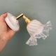 Vintage tulip glass wall light in transparent, slightly pearlescent white.